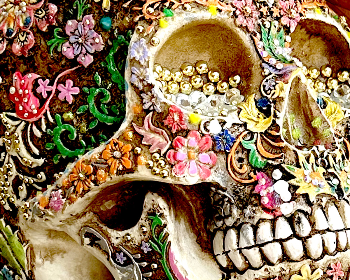 Detail of 'Beauty in Death' decorated resin skull and butterfly by Glen Middleham