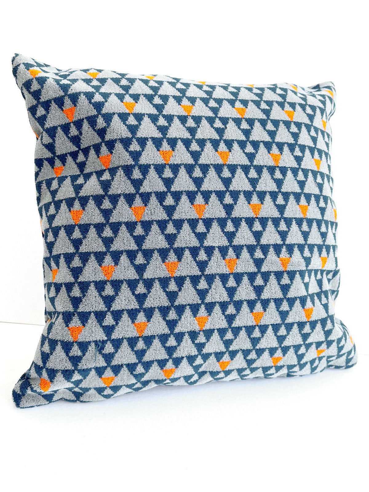 Grey and blue triangles cushion available from Jam