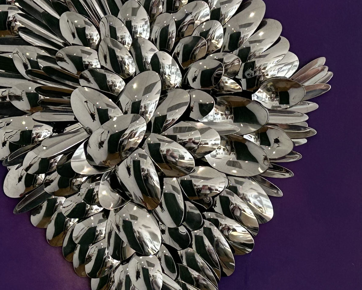 Detail of 'Cutlery Angel Wings' artwork using spoons by Glen Middleham