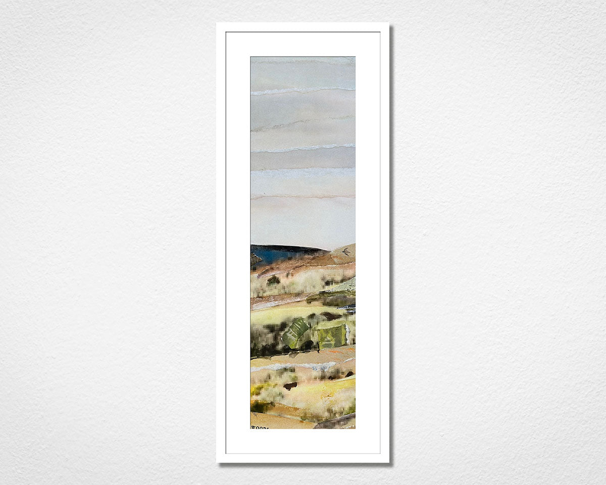 Framed landscape collage of Dartmoor National Park in Devon on a white wall.