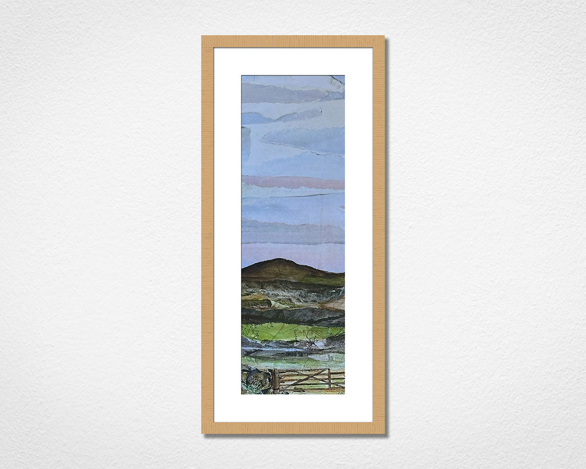 Framed landscape collage of Dartmoor National Park in Devon on a white wall.
