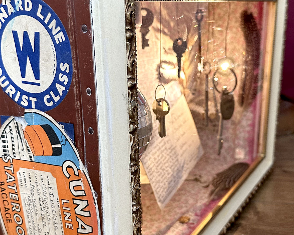Detail of 'Wish You Were Here' vintage holiday suitcase diorama by Glen Middleham