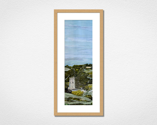 Original landscape art collage of Ashburton, a town close to Dartmoor National Park in Devon in a light oak frame on a white wall
