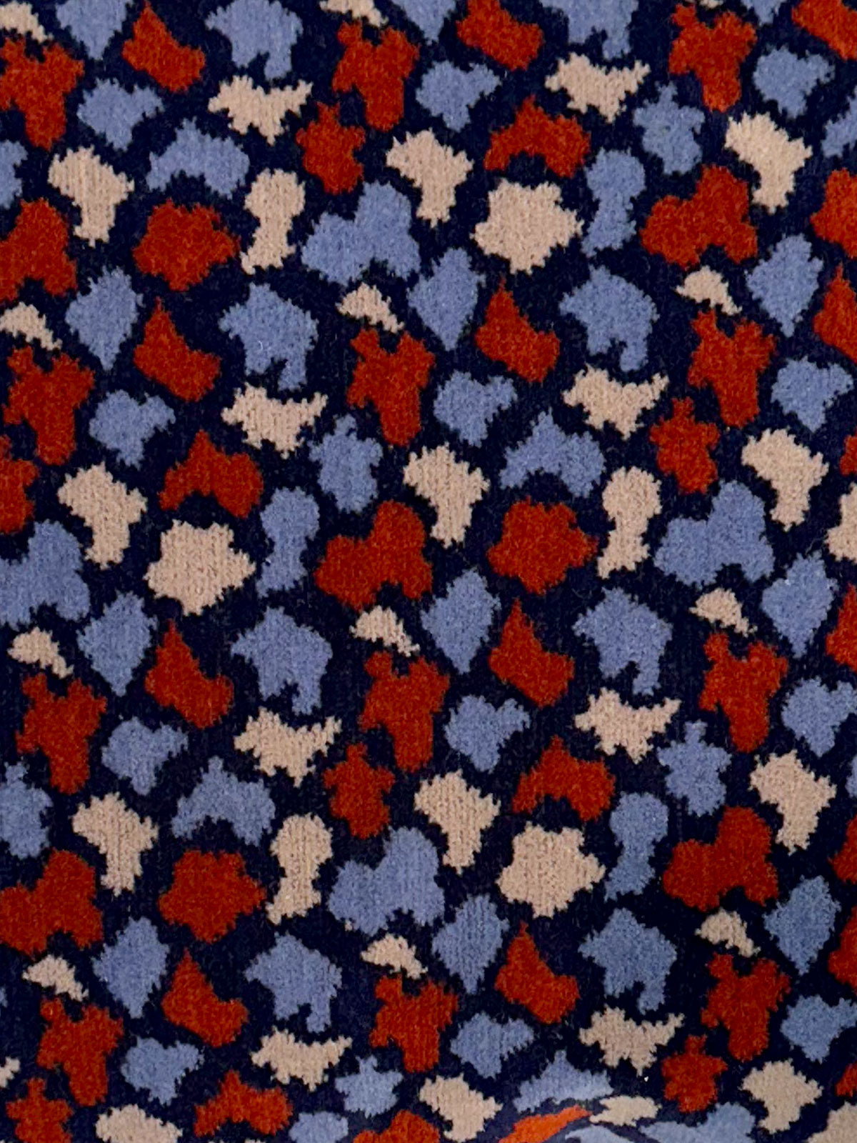 Moquette cushion detail - Blue and red and cream shapes