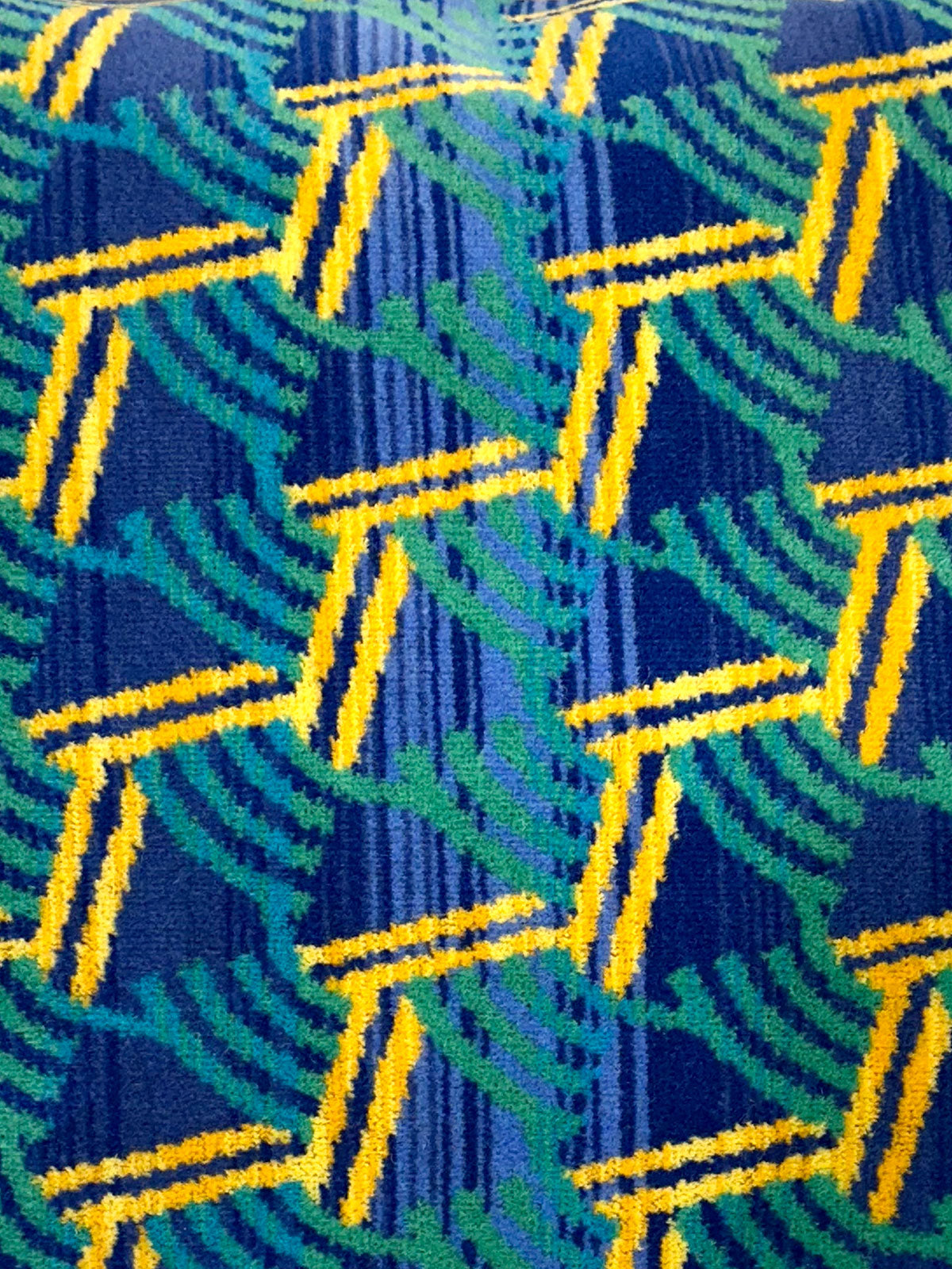 Moquette cushion detail - Blue with green and yellow shapes