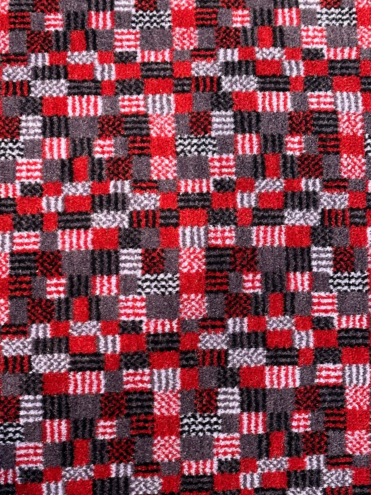 Moquette cushion detail - Grey and red squares