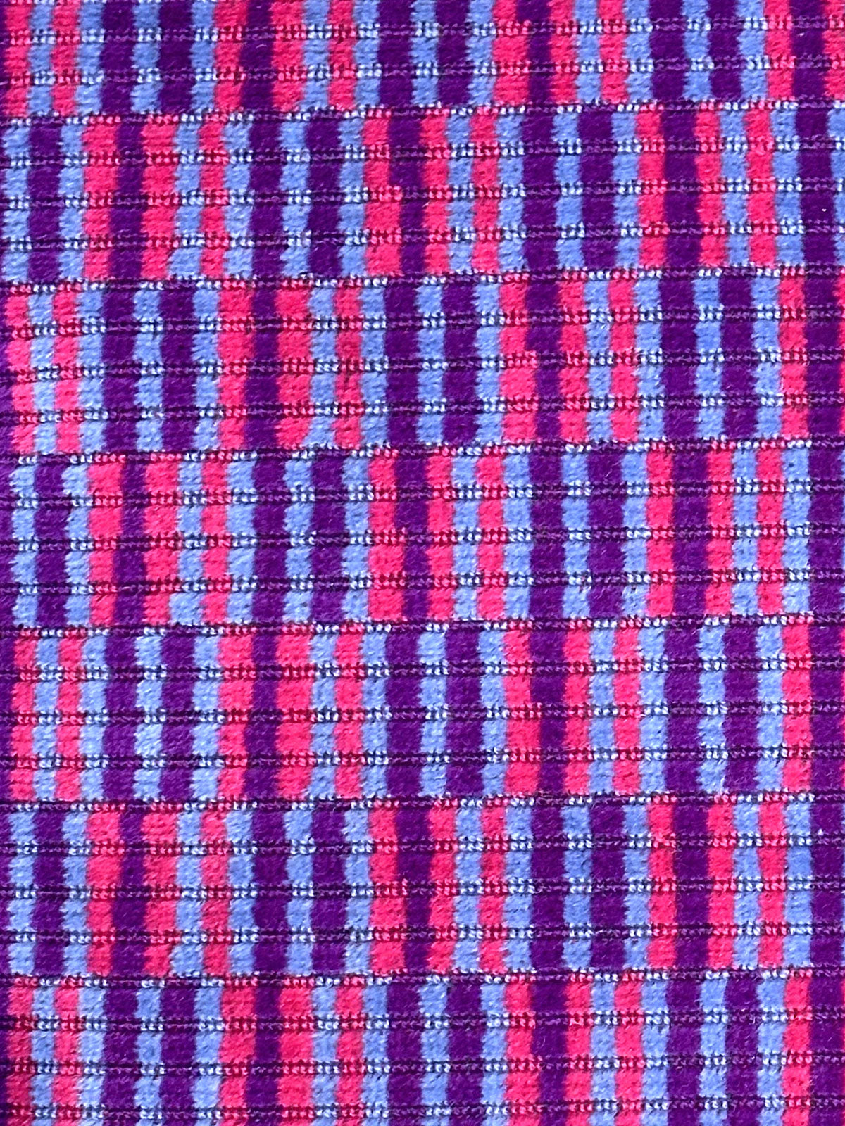 Moquette cushion with purple and pink vertical lines