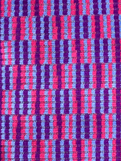 Moquette cushion with purple and pink vertical lines