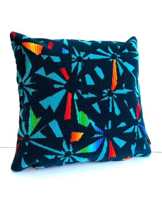 Navy blue moquette cushion with multicoloured fragments