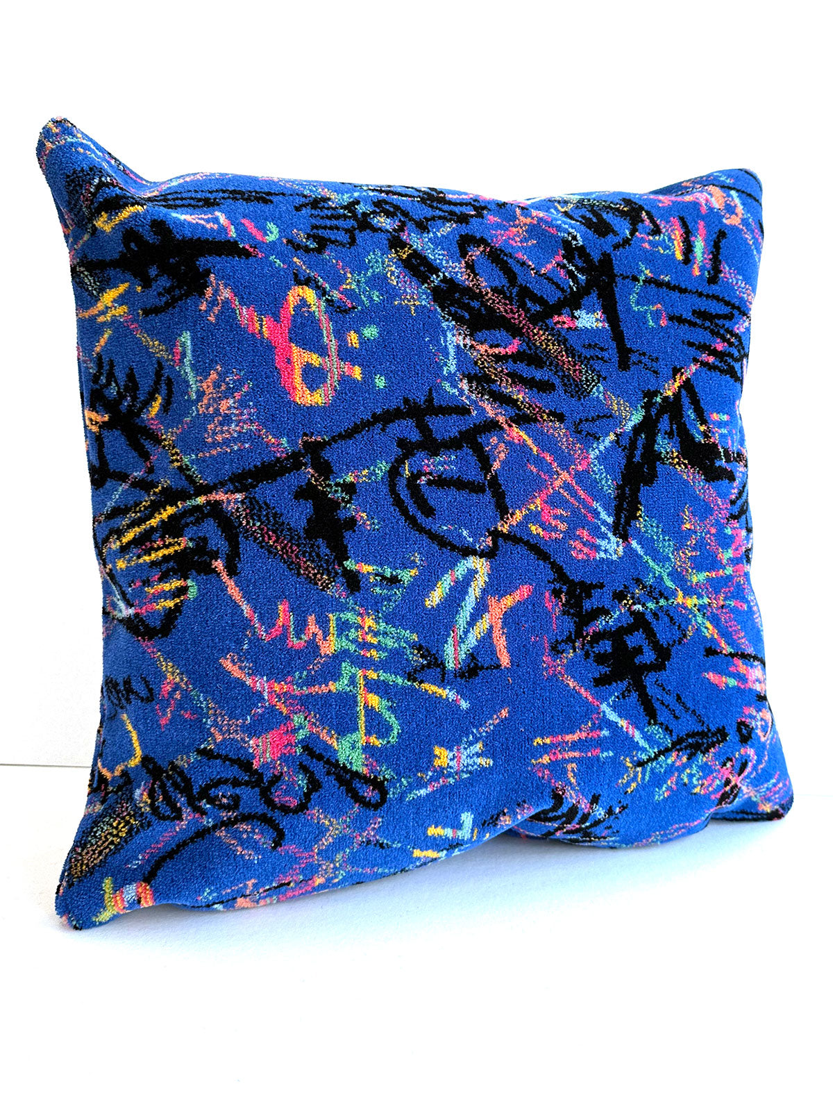 Blue moquette cushion with squiggle design