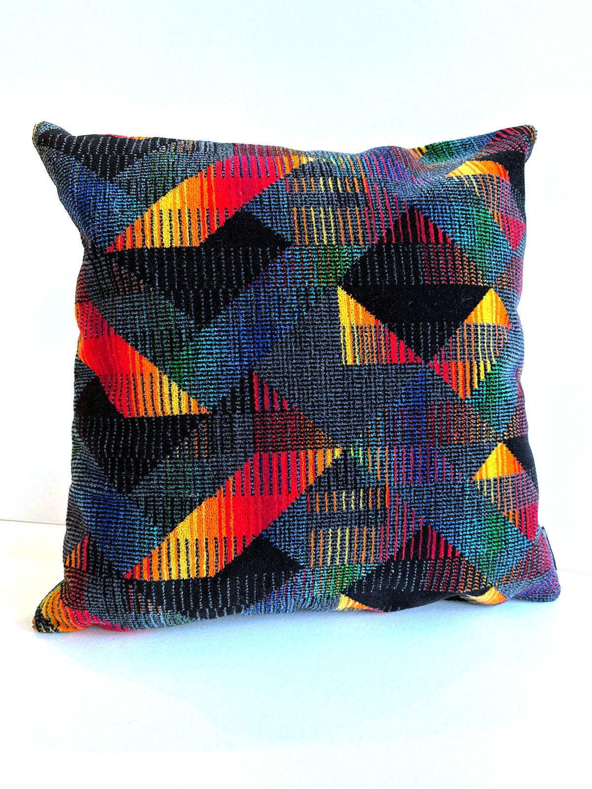 Red and yellow geometrics cushion available from Jam