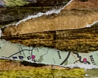 Close-up of textured paper with a map and text overlay