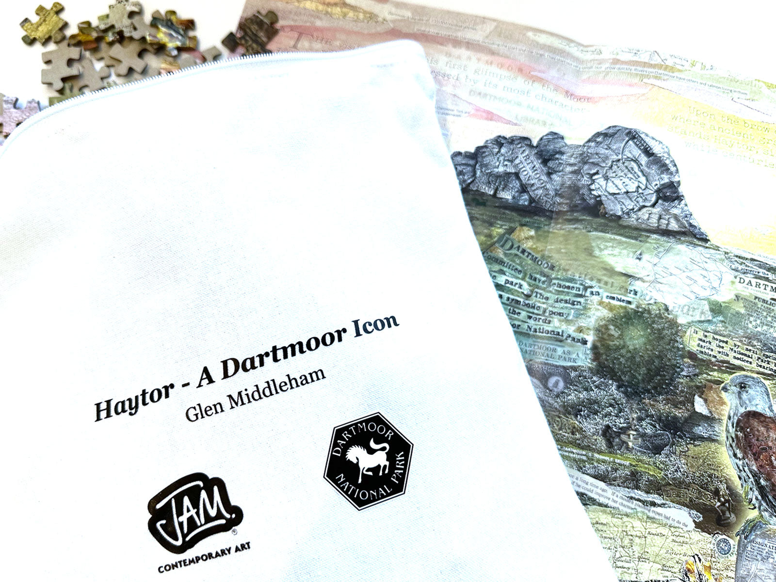 Cloth bag holding pieces from the Haytor – A Dartmoor Icon 1000-piece jigsaw puzzle showing Glen Middleham's mixed media collage of Haytor on Dartmoor
